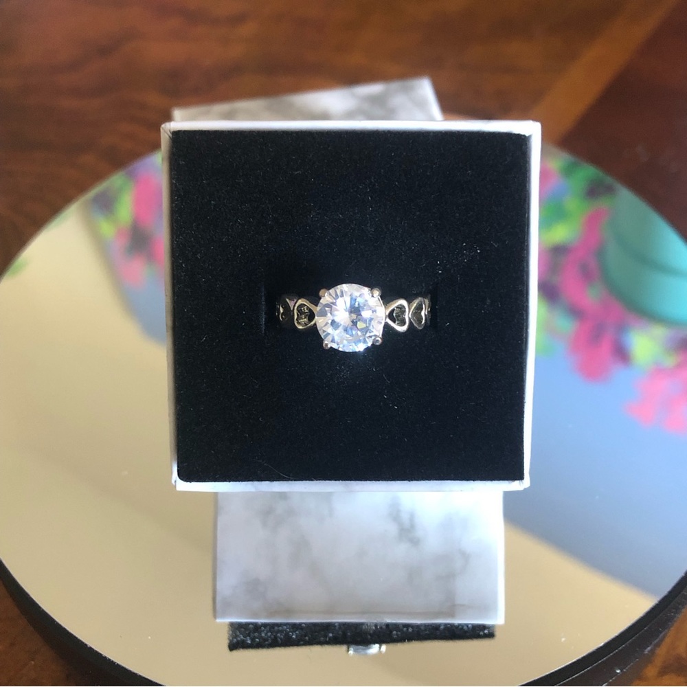 Sterling open heart band prong set round cubic zirconia ring